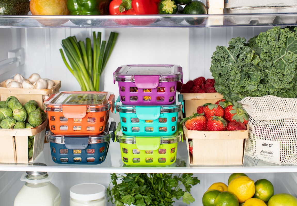Nutritionist preparing healthy meal plans with whole foods and seasonal ingredients